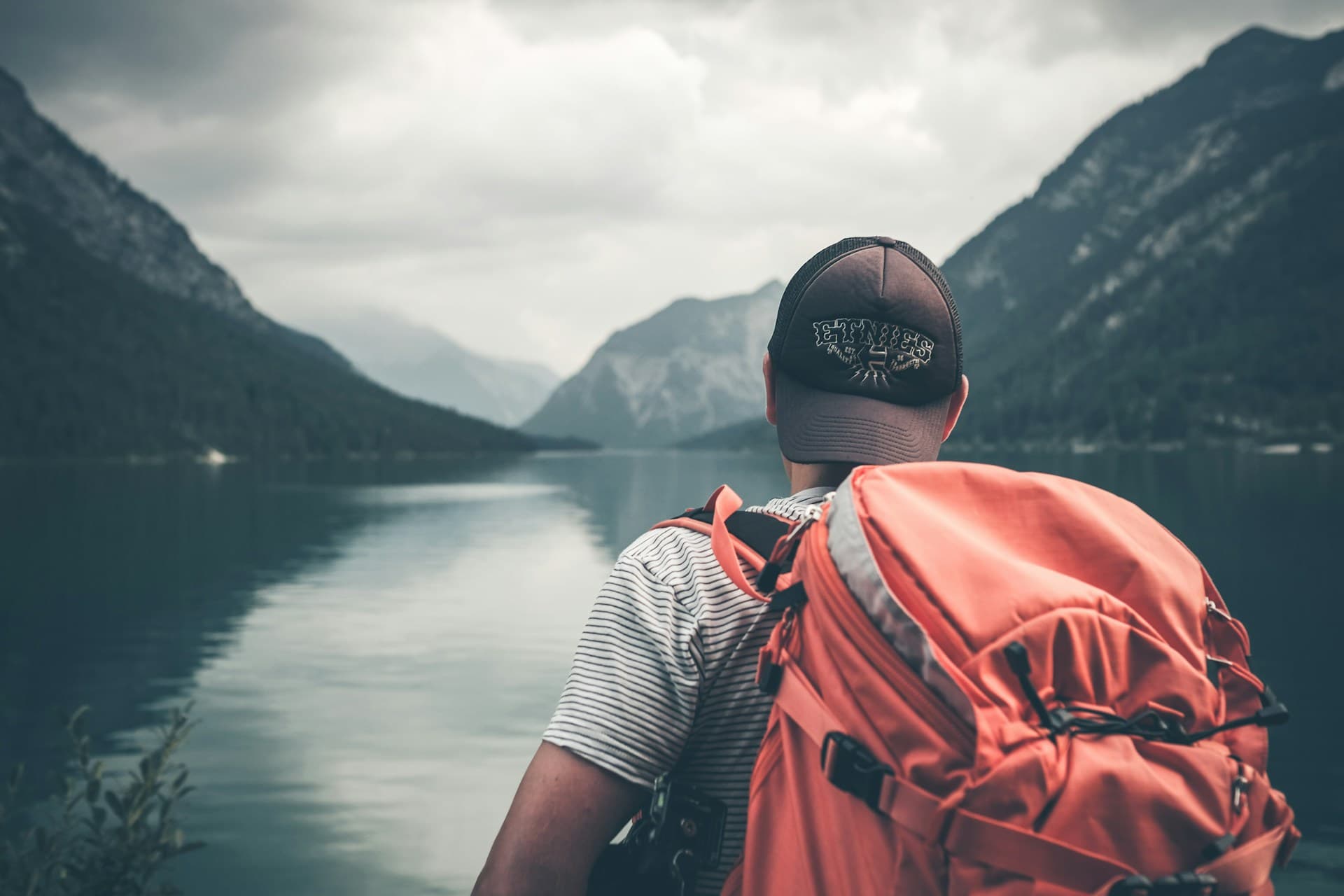 Hiker overlooking a stunning scenic vista at sunrise